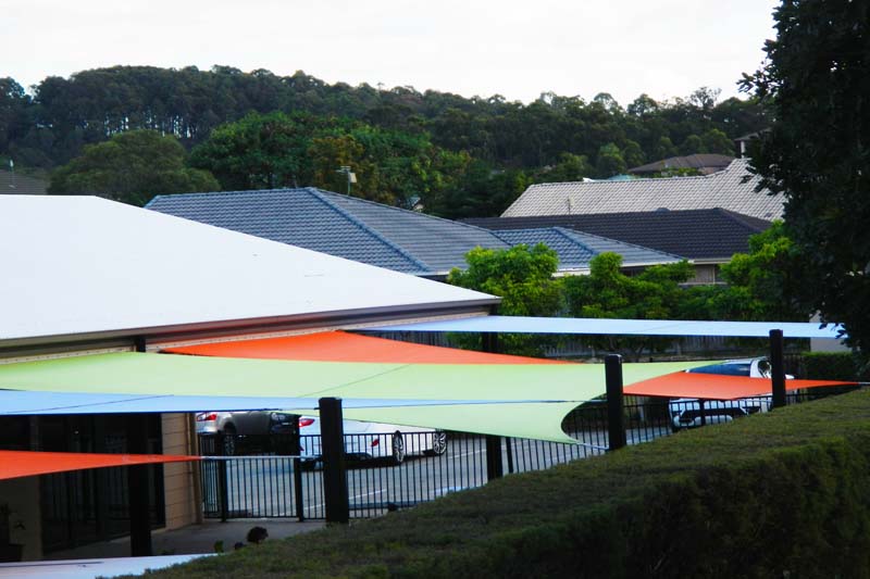 colourful shade sails make the building look good